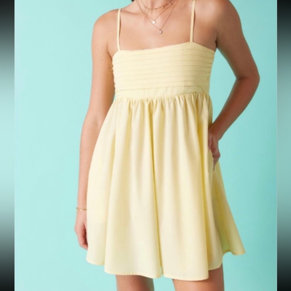 Francesca’s yellow mini dress
